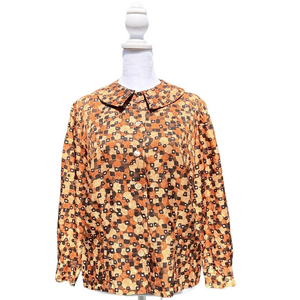 The blouse has a bold Orange & Brown retro/vintage-style print from 70's, Small